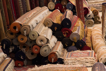 India, Rajasthan, Jaipur, the making of carpets. Rolled carpets for sale.