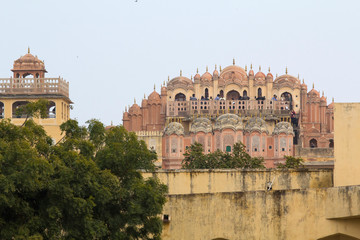 Fototapeta premium India, Rajasthan, Jaipur, Jantar Mantar, open air astronomical observatory. Palace of the Wind, Hawa Mahal, seen from the grounds of the observatory.