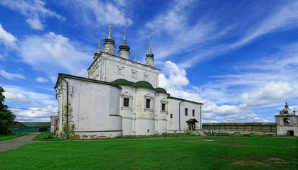 Fototapeta na wymiar Orthodox monastery under blue cloudy sky in summer