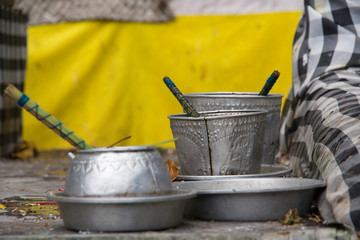 Indonesia, Bali. Hindu priests bless worshipers and devotees with holy water during a temple...