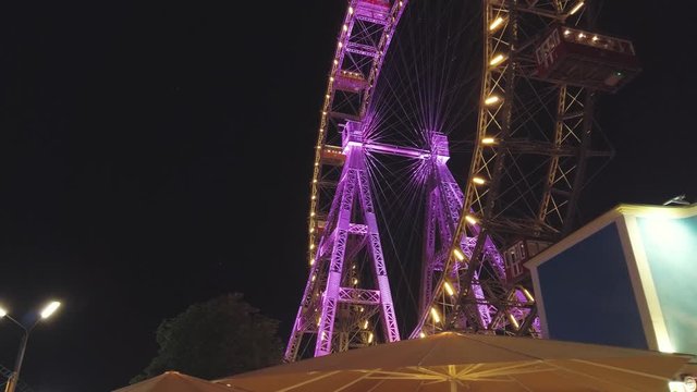 Tourists have fun at the rides in the amusement park.