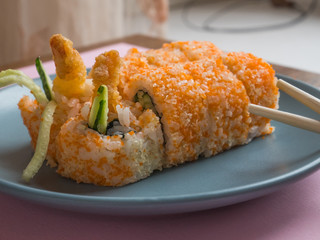 Sushi roll with shrimp on a plate