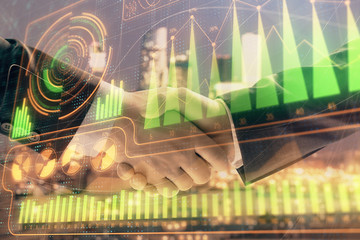 Double exposure of business theme drawing on cityscape background with handshake. Concept of...