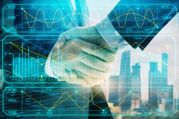 Double exposure of financial graph on cityscape background with two businessman handshake. Concept of stock market deal