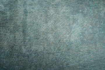 Brushed green metal texture.