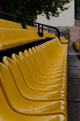 Obraz premium Empty plastic chairs at the stadium. Side view. Outdoors