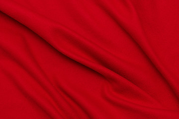 Fototapeta na wymiar Red crumpled blanket, texture, top view