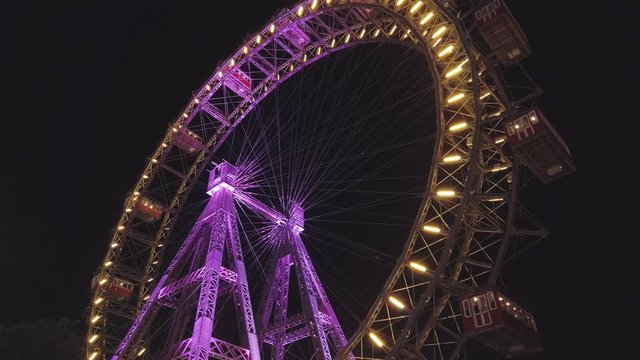 Tourists have fun at the rides in the amusement park.