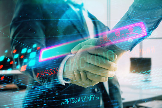 Double exposure of hacking theme hologram on office background with two men handshake. Concept of data security