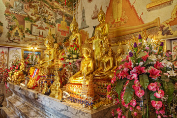Bot and gilded altar of Luang Pho To Wat Intharawihan, Bangkok, Thailand.