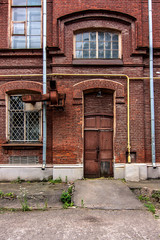 Fototapeta na wymiar Facade from red briks in Kharkiv Polytechnic Institute