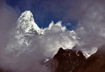 Asia, Nepal, Sagarmatha NP. Ama Dablam juts from the clouds in Sagarmatha National Park, a World Heritage Site, in Nepal.