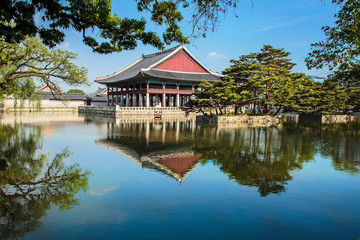 Seoul, South Korea. Geunjeongjeon, Gyeongbokgung Palace, Gyeonghoeru Pavilion and surrounding lake