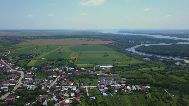 Aerial view of Slatina city and river Olt, Romania. Drone flight over the european city in summer day.