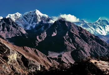 Photo sur Plexiglas Lhotse Asia, Nepal, Sagarmatha NP. Tawache Peak, left of center, and Mt. Everest, Lhotse and Nuptse to the right of the cloud bank, straddle the Nepal-Tibet border.