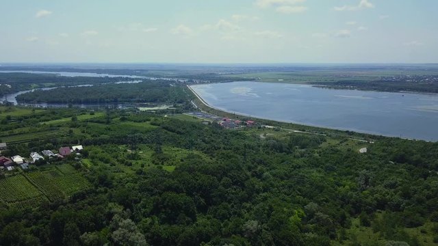 Aerial view of Slatina city and river Olt, Romania. Drone flight over the european city in summer day.