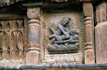 Asia, Nepal, Bhaktapur. Erotic wood carving on the side of temple.