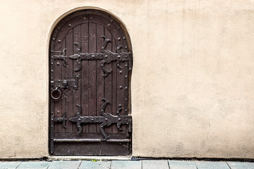mediaeval wooden door with forged elements