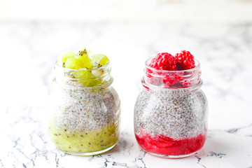 Chia pudding with berries ,raspberry sauce,kiwi sauce,blackberry sauce and frozen raspberries and blackberries and kiwi slices, healthy breakfast, vitamin snack, diet and healthy eating