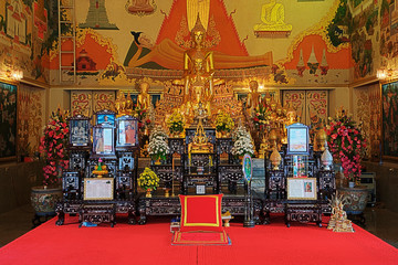 Bot and gilded altar of Luang Pho To Wat Intharawihan, Bangkok, Thailand.