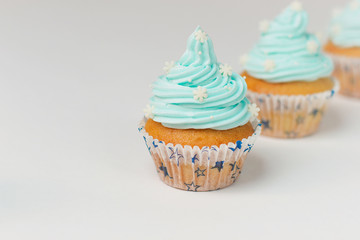 Cupcake decorated with sugar snowflakes and blue cream.Christmas winter cupcakes