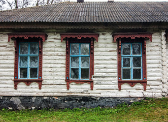 Fototapeta na wymiar Wooden old privat house with windows in Ukraine