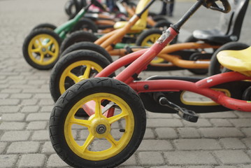 Fototapeta na wymiar child tricycle bikes on the pavement 