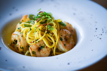 fresh italian pasta with garlic, pepperoni, olive oil & grilled shrimps