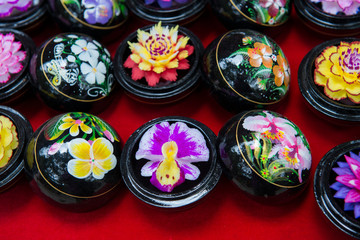 Fototapeta na wymiar Thailand, Samui Island, Ko Samui. Traditional handicrafts, intricately carved soap to look like tropical flowers.