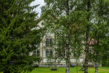 Fototapeta na wymiar The old wooden church of Enonkoski in Finland in summer - 4