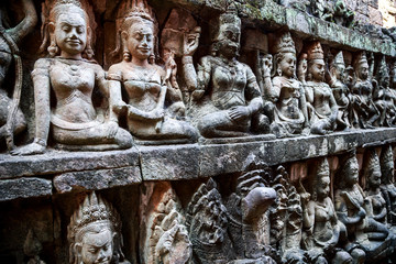 Siem Reap, Cambodia. Stone reliefs depicting a Devata and Aspara, female spirits and guardians of...
