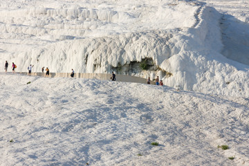 Naklejka premium Tourists on terraces of Pamukkale (UNESCO World Heritage Site), Turkey