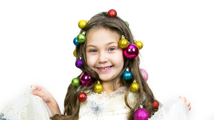 Little girl with Christmas ornaments braided in hair on a white background Isolated.