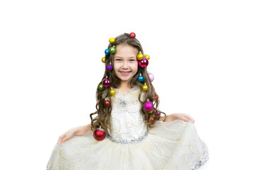 Little girl with Christmas ornaments braided in hair on white background. Isolated