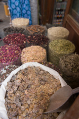 United Arab Emirates, Dubai, Deira district, Spice Souk. Bags of frankincense and dried spices for sale.