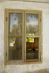 Fototapeta na wymiar Cambodia. Phnom Penh. Tuol Sleng Genocide Museum. Site of Khmer Rouge S21 prison. View into a cell.