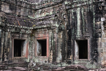 Siem Reap, Cambodia. Ancient ruins and windows of the Bayon Temple in Preah Khan