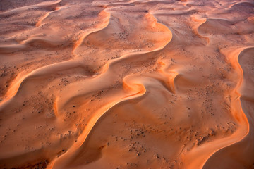 Fototapeta na wymiar Aerial view of the sand dunes of the Arabian Desert next to Dubai, United Arab Emirates
