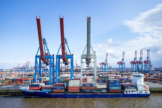 HAMBURG, GERMANY - June 4, 2017: 1036 TEU container ship KATHARINA SCHEPERS at container terminal Burchardkai (CTB). CTB is the largest terminal of HHLA in the port of Hamburg.