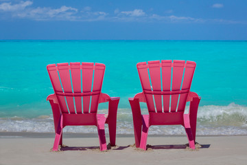 Bahamas, Little Exuma Island. Pink chairs on beach. Credit as: Don Paulson / Jaynes Gallery / DanitaDelimont.com