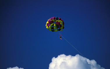 Caribbean, Bahamas, Grand Bahama Island. Parasailing in the sky.