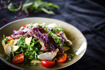 grilled beef salad with caramelized onion and fresh vegetables