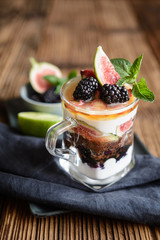 Sweet dessert with Ricotta cheese, crushed cookies, rhubarb, figs, topped with maple syrup