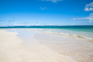 Vieques, Puerto Rico - Gentle waves are rolling up onto the white sands of a tropical beach.