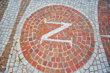 the letter N in the pavement