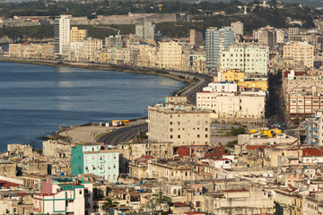 Cuba, Havana. An elevated view of the city skyline showing the bay and Malecon from a hotel rooftop.