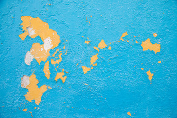 Cuba, Regla. Colorful paint deterioration and wall detail that appears like a world map