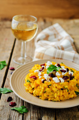 Pumpkin risotto with dried cranberries and goat cheese