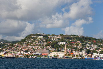 Fototapeta na wymiar MARTINIQUE. French Antilles. West Indies. City of Fort-de-France below cumulus clouds.
