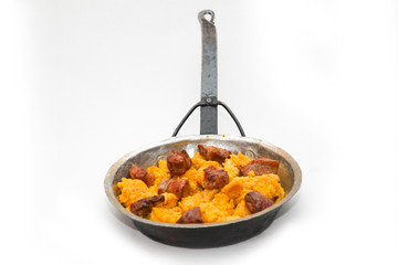 frying pan with sausage and potato ragout